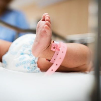 A woman holding a baby